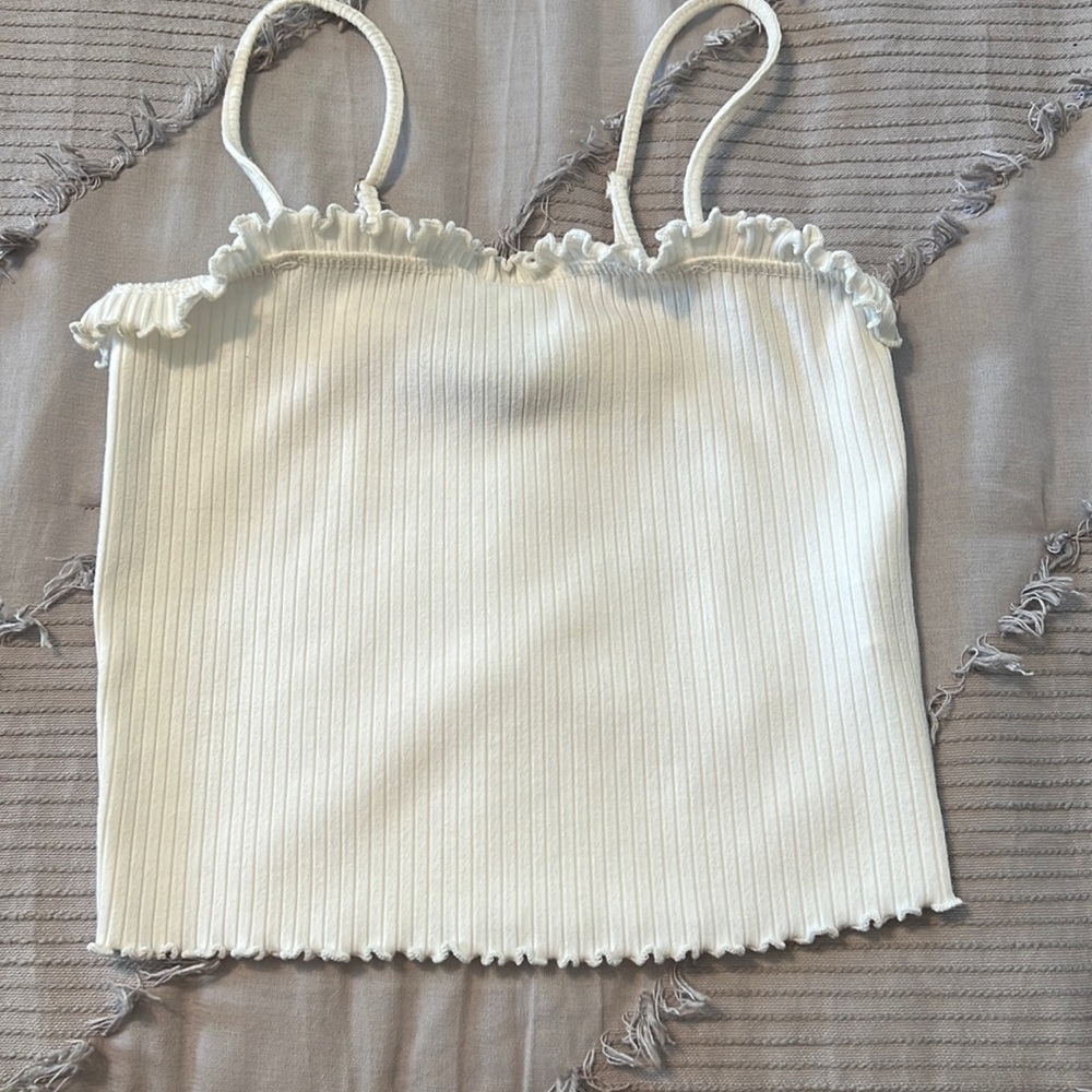 white tank top with ruffles on top and bottom